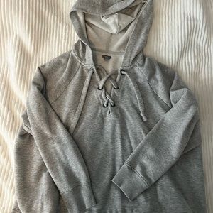 Light gray cropped sweatshirt.
